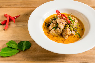 Pork curry spicy flavors in food of the Thai people. Posed decorated with vegetables and herbs. It appetizing fragrance invite hungry.
