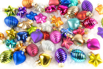 Fototapeta na wymiar A lot of colourful Christmas balls in the snow