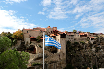 Greece. Meteora. The Greece flag with the Holy Monastery of Great Meteoron, the Transfiguration of Jesus.