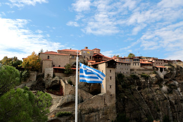 Greece. Meteora. The Greece flag with the Holy Monastery of Great Meteoron, the Transfiguration of Jesus.