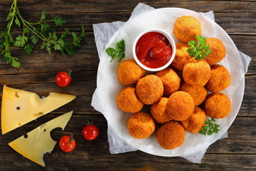 deep fried potato croquettes with tomato sauce