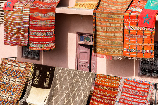 colorful carpets hanging at moroccan shops, marrakech