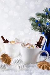 Holiday cup of  cocoa with marshmallow or coffee with spice and home cookies. Christmas background.