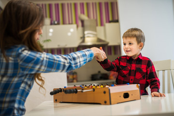 Mom and son are playing