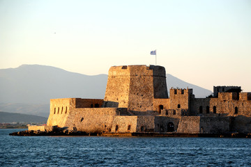 The Bourtzi water castle is a small island with a fortress at the coast of Nafplio in Greece