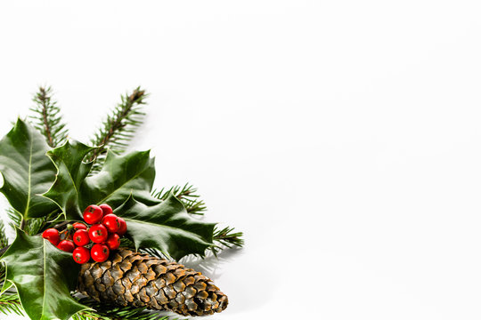 Decoration with christmas holly isolated on white background