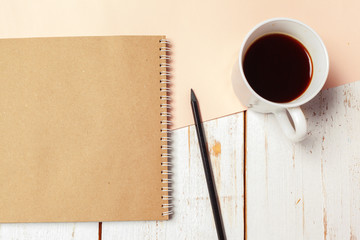 Office wood table with blank notepad, pencil.