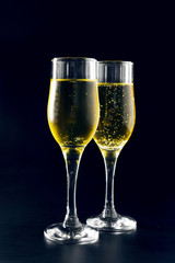 Champagne glass on black background