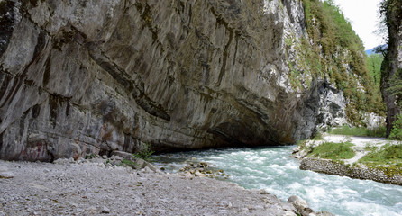 mountain river flowing into the rock