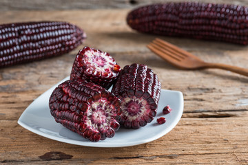 Purple corn on woodbackground