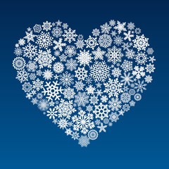 vector heart made of little snowflakes on blue background - 181460033