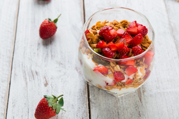 Strawberry , granola and yogurt healthy breakfast parfait