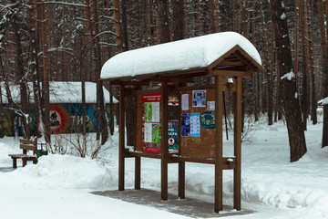 Forest Park in Russia. Winter. The city of Ulyanovsk. Snow. New Year.  Notice board in the park. The park plan.