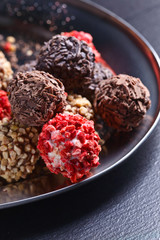 Homemade candy with chocolate , nuts and dried strawberry