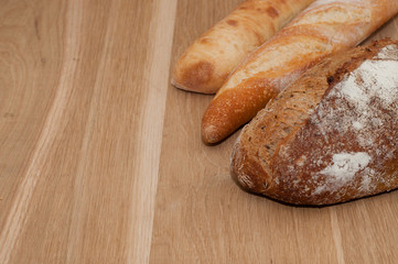 Bread on a wooden background with space for text