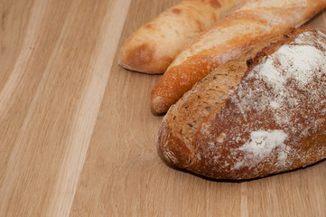 Bread on a wooden background with space for text