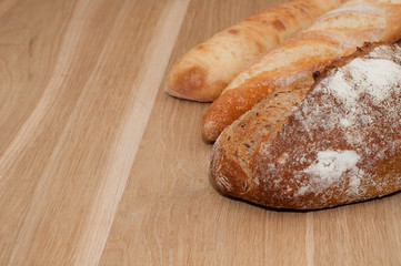 Bread on a wooden background with space for text