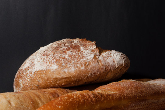 French bread on a black background
