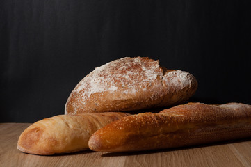 French bread on a black background