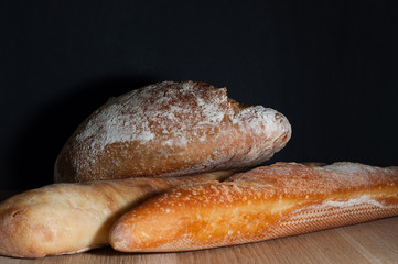 French bread on a black background
