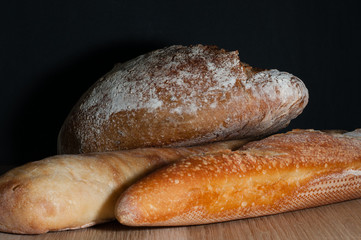 French bread on a black background