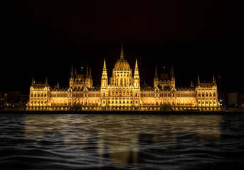 Night view of the Hungarian Parliament in Budapest, Hungary.