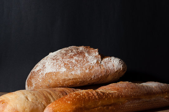 French bread on a black background