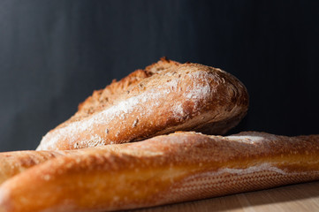French bread on a black background