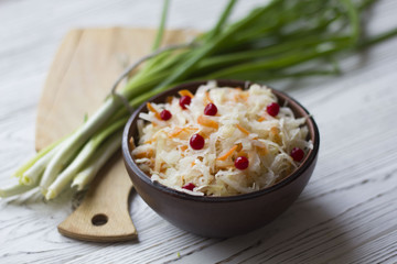 Traditional Russian pickled cucumbers, onions, beets, chili, garlic, sauerkraut with cranberries on the table