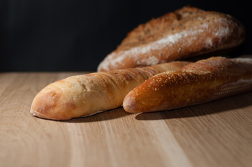 French bread on a black background