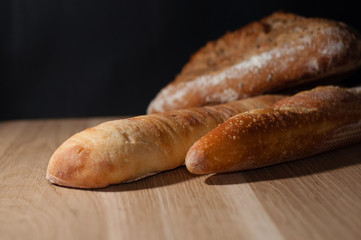 French bread on a black background