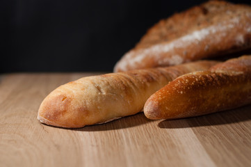 French bread on a black background