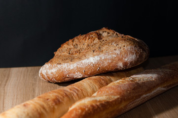 French bread on a black background