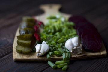 vegetables : onions, garlic, cucumbers, beets, chili peppers on the table