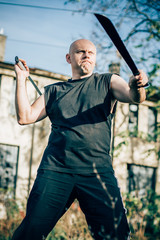 Two machete fighting concept. Long knife weapon training