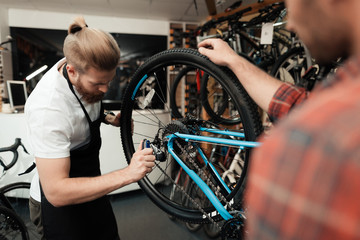 A young guy came to the workshop to repair his bicycle.