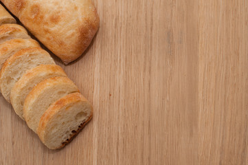 Ciabatta on a wooden board with space for text