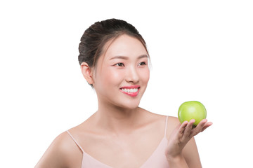 Smiling woman with healthy teeth holding green apple