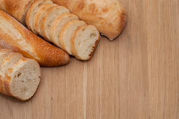 French loaf and ciabatta on a wooden board with space for text