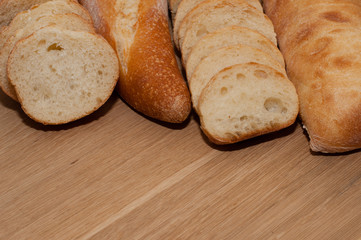 French loaf and ciabatta on a wooden board with space for text