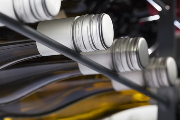 Quality wine bottles with screw caps in a wine rack