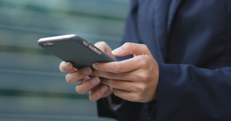 Businesswoman using cellphone