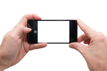 male person horizontally holding a smartphone with both hands ready to take a picture isolated on white