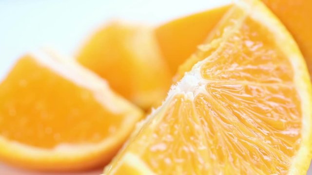 Close up of fresh orange slice on white table. Series