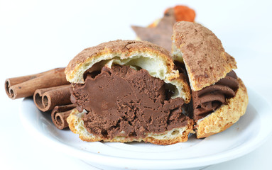 Freshly baked chocolate sweet delicious cream cookie was cutted in a plate, selective focus