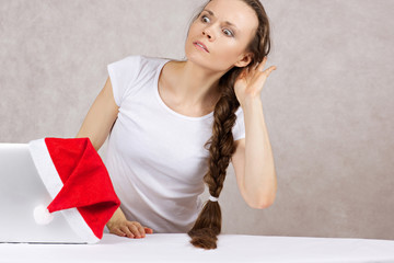 Young lady is trying to hear some information