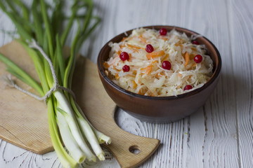 Traditional Russian pickled cucumbers, onions, beets, chili, garlic, sauerkraut with cranberries on the table