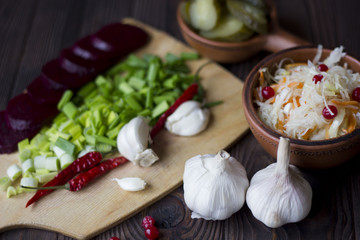 sauersauerkraut and vegetables : onions, garlic, cucumbers, beets, chili peppers on the table