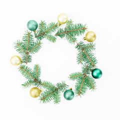 Christmas round frame of winter trees, golden balls on white background. Winter concept. Flat lay, top view
