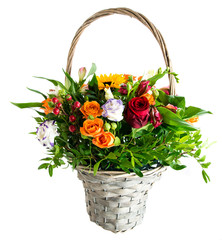 Fototapeta na wymiar Beautiful fresh red, yellow and orange flowers in a basket on light background. For Mothers Day